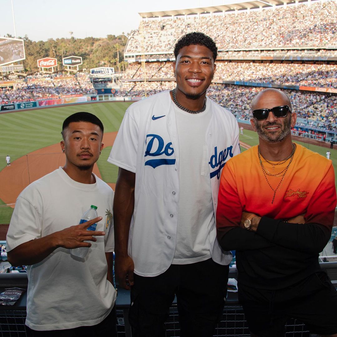 Rui Hachimura at a baseball game with the LA Dodgers, surrounded by family joy to welcome Shohei Ohtani