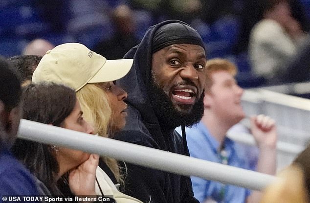 LeBron James and his wife Savannah Brinson watch Bronny James at the Draft Combine