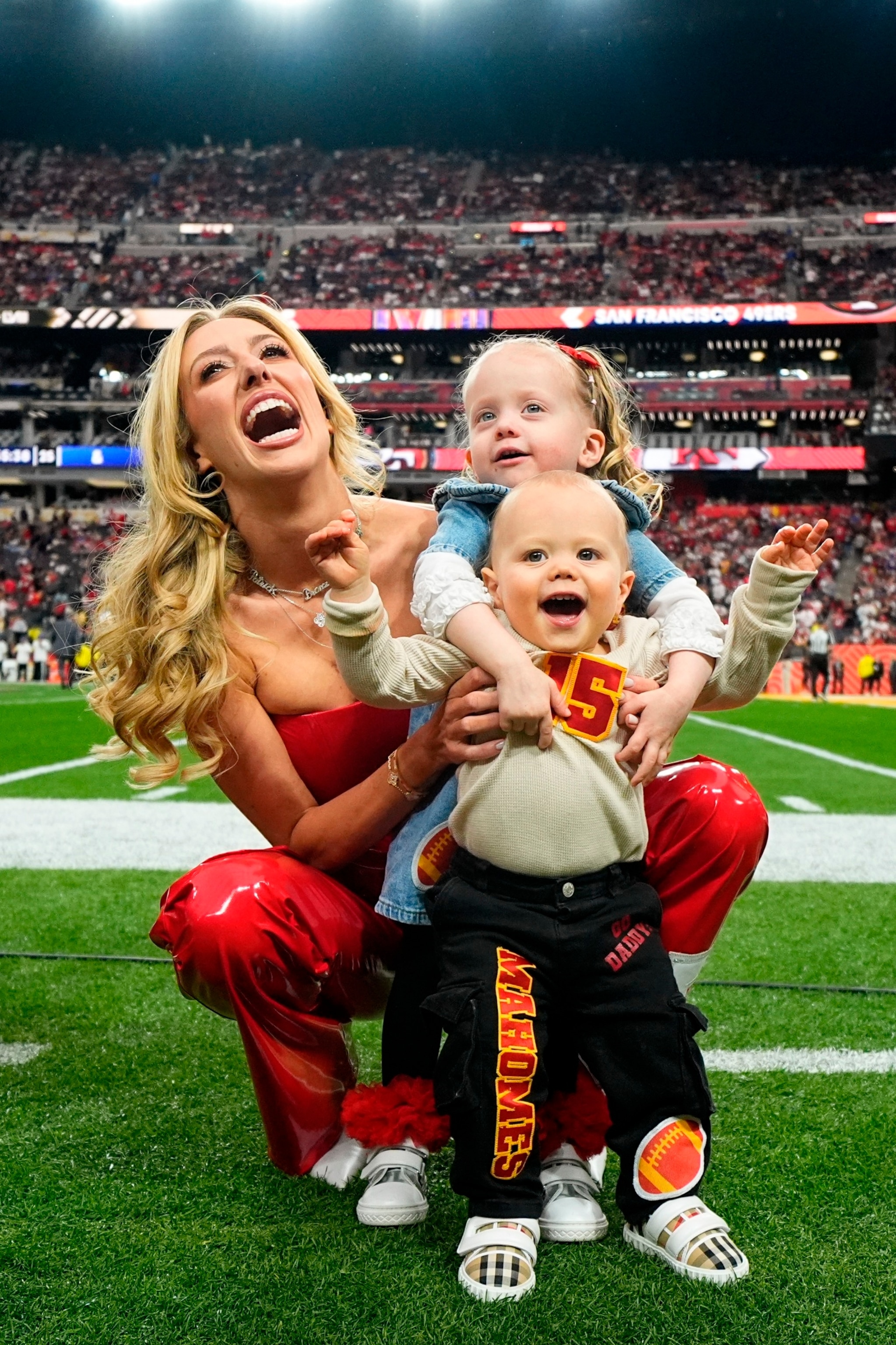 PHOTO: Brittany Mahomes poses for a photo with her children before the NFL Super Bowl 58 football game between the San Francisco 49ers and the Kansas City Chiefs, Feb. 11, 2024, in Las Vegas.