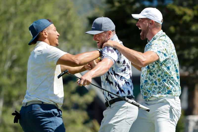 STATELINE, NV - JULY 08: NFL football players Travis Kelce and Patrick Mahomes react to Kelce making a putt for an eagle on the 18th hole during Round One of the 2022 American Century Championship at Edgewood Tahoe Golf Course on July 8, 2022 in Stateline, Nevada. (Photo by Isaiah Vazquez/Clarkson Creative/Getty Images)